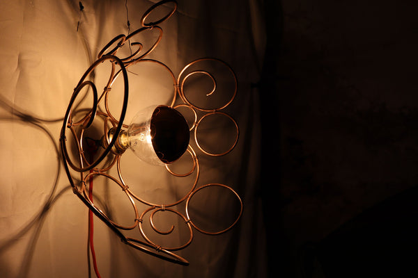 QUARTIERI Applique da muro con cerchi e spirali di vari diametri