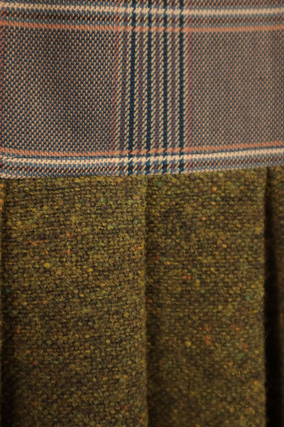 Abito lento con gonna in lana verde e corpino in tessuto